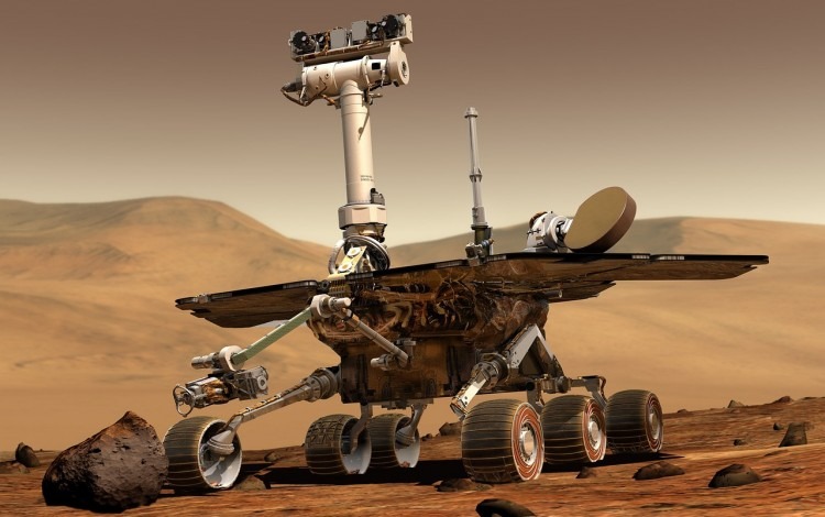 Imagen de vehículo rover explorando superficie de planeta.