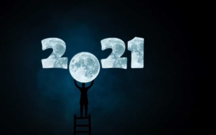 Ilustración de una persona colocando la Luna en lugar del cero en año 2021.