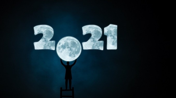 Ilustración de una persona colocando la Luna en lugar del cero en año 2021.